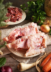 Raw chicken backs, liver and fresh vegetables - Ingredients for bone broth or soup