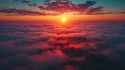 Fototapeta premium aerial drone descent over old village at sunrise aerial camera bird eye view unsurpassed view of the sun which illuminates the whole landscape thick fog covered all the fields