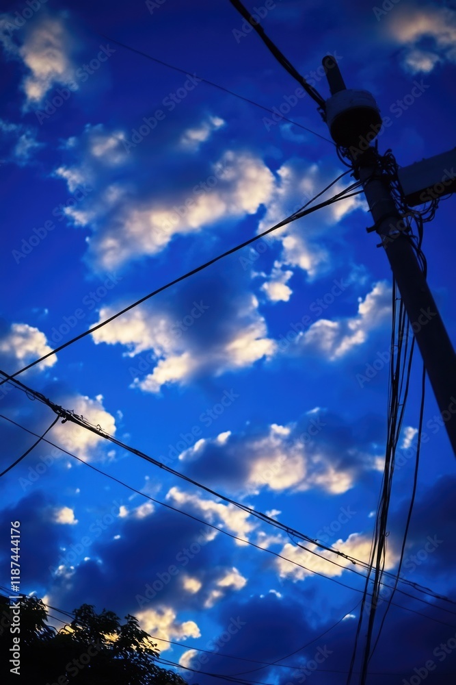 Poster telephone pole with power lines and cloudy sky