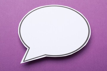 Blank speech bubble on purple background. Space for text