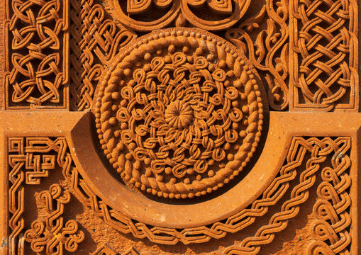 Beautiful traditional ornaments and patterns carved in stone. Close-up.