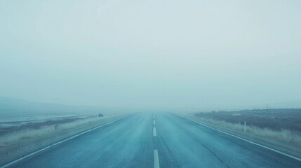 Fototapeta premium An empty road, midfield, foggy day, stop sign side