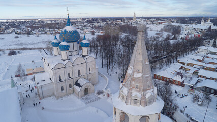 Snow covered city with a large church and a small church