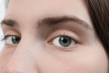 Closeup view of young woman with beautiful blue eyes