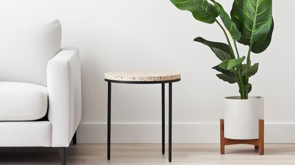 Fototapeta premium Furniture trendy luxury and innovative, A minimalist living space featuring a stylish side table and a decorative potted plant next to a light-colored couch.