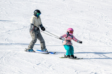 People are having fun in downhill skiing and snowboarding	