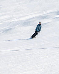 People are having fun in downhill skiing and snowboarding	