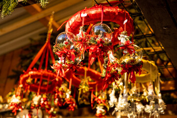 Christmas decoration at the Christmas market fair in the center of European city. Vienna Christmas market on the main square with colorful lights, candles and round balls for decorating fir tree