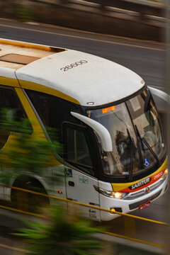 Tourism bus in motion on a highway - Brazilian public transportation panning shot