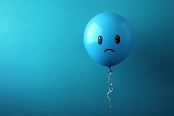 Sad Blue Balloon on Blue Background Minimalist Image of Unhappiness and Melancholy