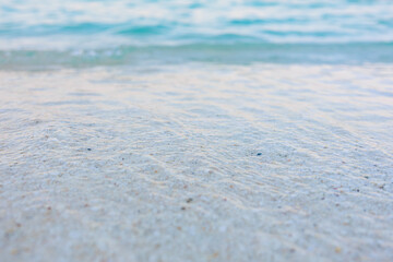 A beautiful blue ocean with a sandy beach