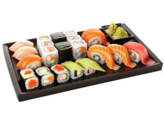 Sushi Japan Assortment of nigiri and maki sushi rolls with fresh ginger, wasabi and soy sauce in traditional ceramic platter,