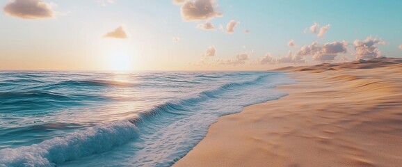 Fototapeta premium Serene sunset over ocean waves gently lapping a sandy beach.