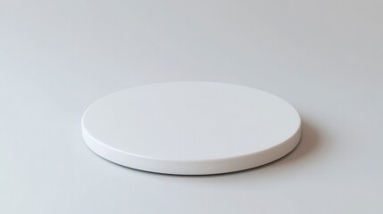 Isolated round white pills on a clean white porcelain plate suggest blank medical care