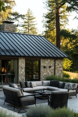 Obraz premium Cozy outdoor seating area designed for relaxation, surrounded by tall trees and a charming stone house during a serene evening light