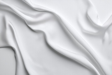 Obraz premium smooth white fabric drapes elegantly, showcasing soft folds and textures. Perfect for backgrounds or textile designs