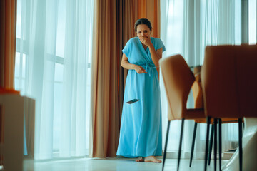 Unlucky Woman Dropping her Phone on the Floor Causing Damage. Socked lady ruining her smartphone...