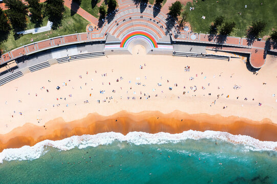 Aerial drone view of Coogee beach with people, Sydney, Australia