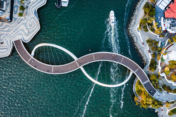 Aerial drone view of Elizabeth Quay Bridge with infinity symbol shape, Perth, Australia