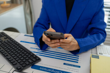businesswoman sitting by the window with mobile phone at startup office, connection and woman typing on a phone for communication, female entrepreneur with smart phone and laptop working in office