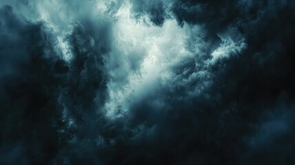Fototapeta premium Dramatic Dark Storm Clouds with Light Breaking Through the Sky
