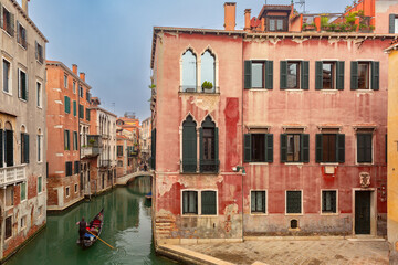 Old medieval traditional colorful houses over the canals in the early morning, Venice, Italy