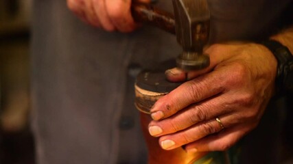 A Focused Shot Of A Shoemaker Hammering A Sole Onto A Boot, Showcasing Skilled Craftsmanship, Textured Hands, And The Artistry Of Traditional Leatherwork In Warm Lighting - Marquette, Michigan