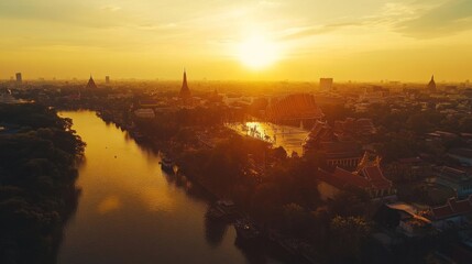 Fototapeta premium A panoramic view of Sanam Luang, Thailand, with the Grand Palace and Wat Phra Kaew visible in the background, set under the golden evening light