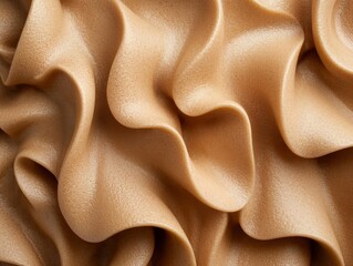 Flowing beige fabric texture with soft, wavy folds and shimmery surface