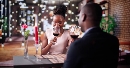Portrait Of Romantic Couple Toasting Red Wine