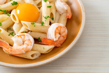 penne pasta white cream sauce with shrimps and egg
