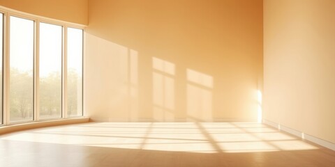 Sunlight streaming through a large window casts rectangular shadows on the floor of an empty room.