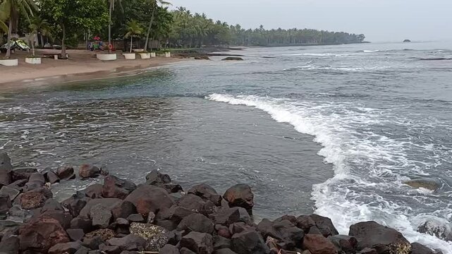 Side View of Ocean Waves Rolling Toward Anyer Beach Shoreline