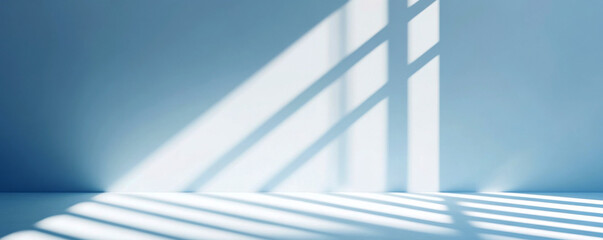 Fototapeta premium Soft blue interior with shadows creating a soothing atmosphere.