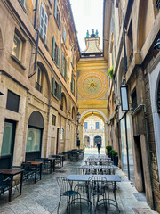 The golden metal star with the wavy rays of the sun in the middle of the antique astronomical renaissance Clock in the Torre dell Orologio, Clock Tower, in Piazza della Loggia, Brescia, Lombardy,Italy