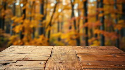 Fototapeta premium Rustic wooden table top with a blurred background of autumnal foliage, featuring warm colors and natural textures