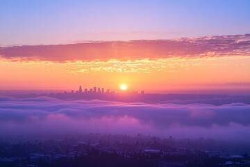 Obraz premium Sunset over Los Angeles skyline viewed from the hills with vibrant colors and low-hanging clouds