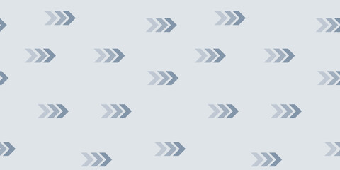 Unique pattern of arrows in various shades on a light blue background creating a modern design