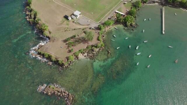 "Aerial imagery highlighting Tobago's greenery and expansive beach at Fort ames in Plymouth