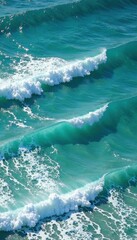 Obraz premium Shimmering blue-green sea, breaking waves with frothy white crests , bright, beach, vibrant