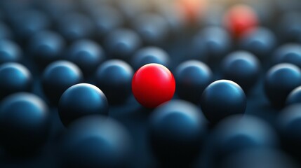 Naklejka premium A red sphere in focus surrounded by blurred blue spheres, symbolizing individuality
