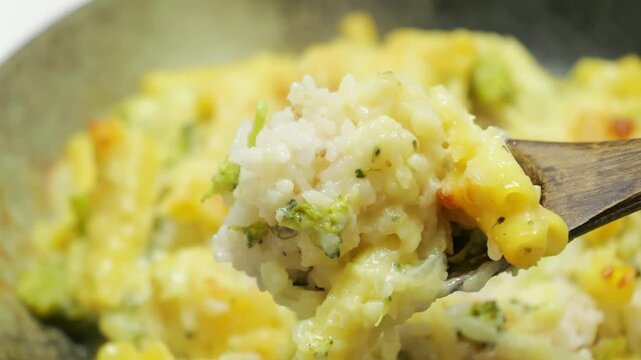 Gratin (doria) made with vegetables, macaroni, cheese and rice. Looks warm and delicious