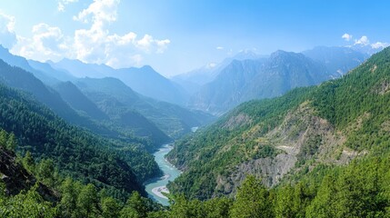 Naklejka premium Panoramic view of a vast mountain valley with a river winding through it, surrounded by dense forests and high peaks.