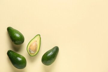 Fresh ripe avocados on yellow background