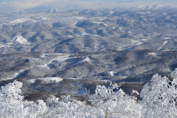 aerial view of winter mountain landscape with snow in Hokkaido, Japan