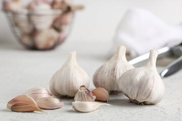 Fresh garlic and cloves on white background