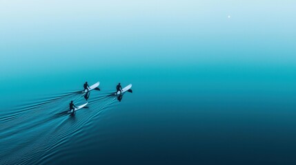 Surfers Paddling in Calm Waters Under Clear Blue Sky