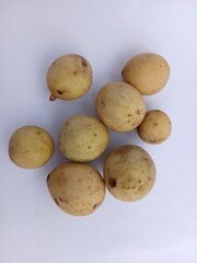 duku fruits isolated on white background. a close up view of duku fruits.