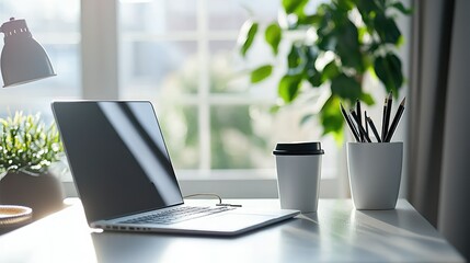 Fototapeta premium Cozy Workspace with Laptop, Coffee Cup, and Potted Plant