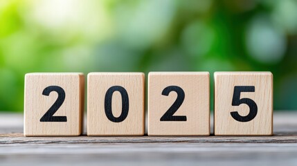 A wooden block with the numbers 20, 25, and 25 stacked on top of each other